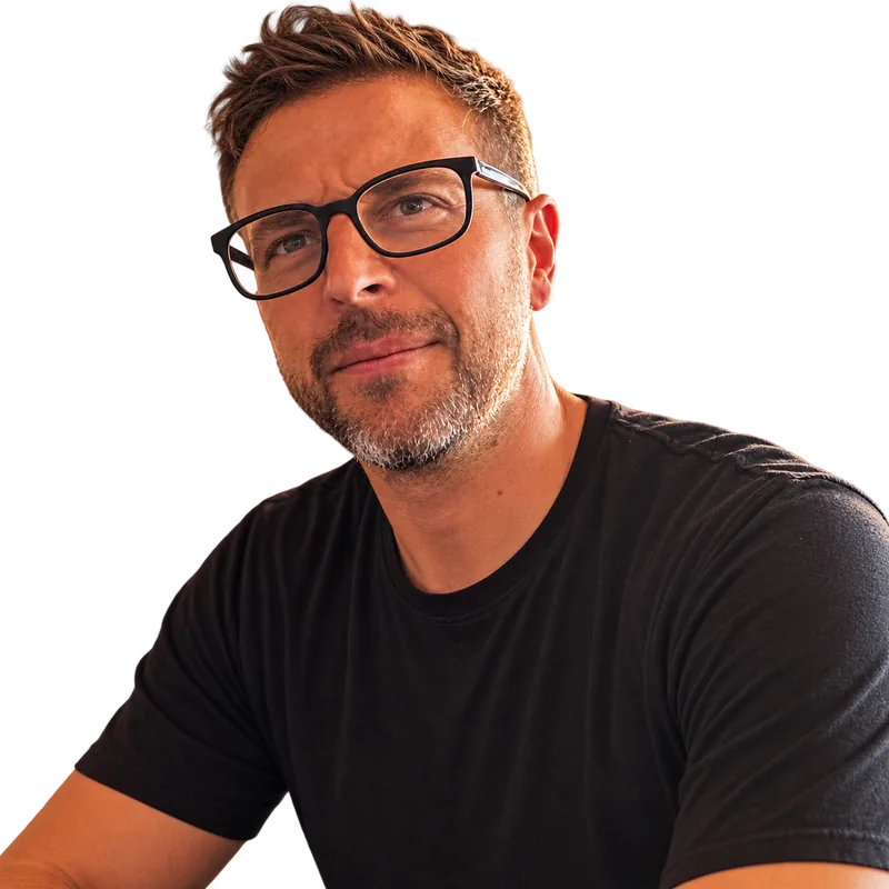 Tim Nafe, wearing black-framed glasses and a black T-shirt.